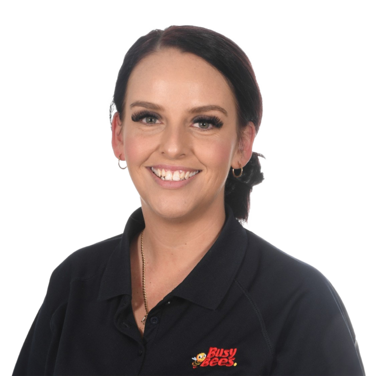 Jessica Chiementon, Assistant Manager of Busy Bees Burpengary East smiling at the camera, wearing a black collared shirt with the "Busy Bees" logo on it.