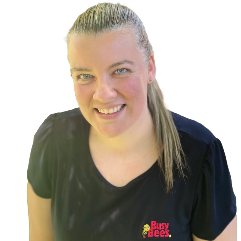 Rebecca Greig the Assistant Manager of Jenny Wren Early Learning, wearing a black shirt with the Busy Bees logo, smiling at the camera.