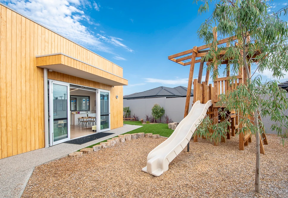 Timber fort with slide at Craigieburn childcare centre