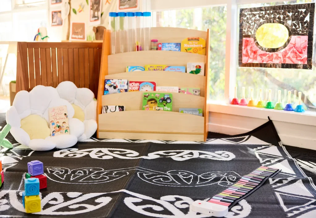 Reading area at Doncaster East childcare featuring a black and white rug.