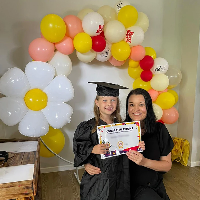 Service Manager with graduating kindergarten child